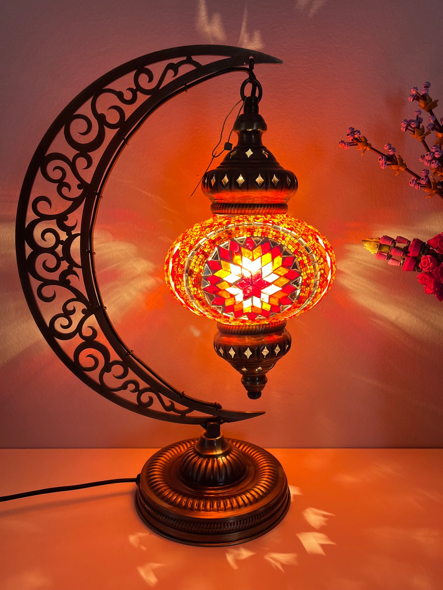 Elegant hanging Turkish lamp featuring red and orange mosaic, available in Calgary