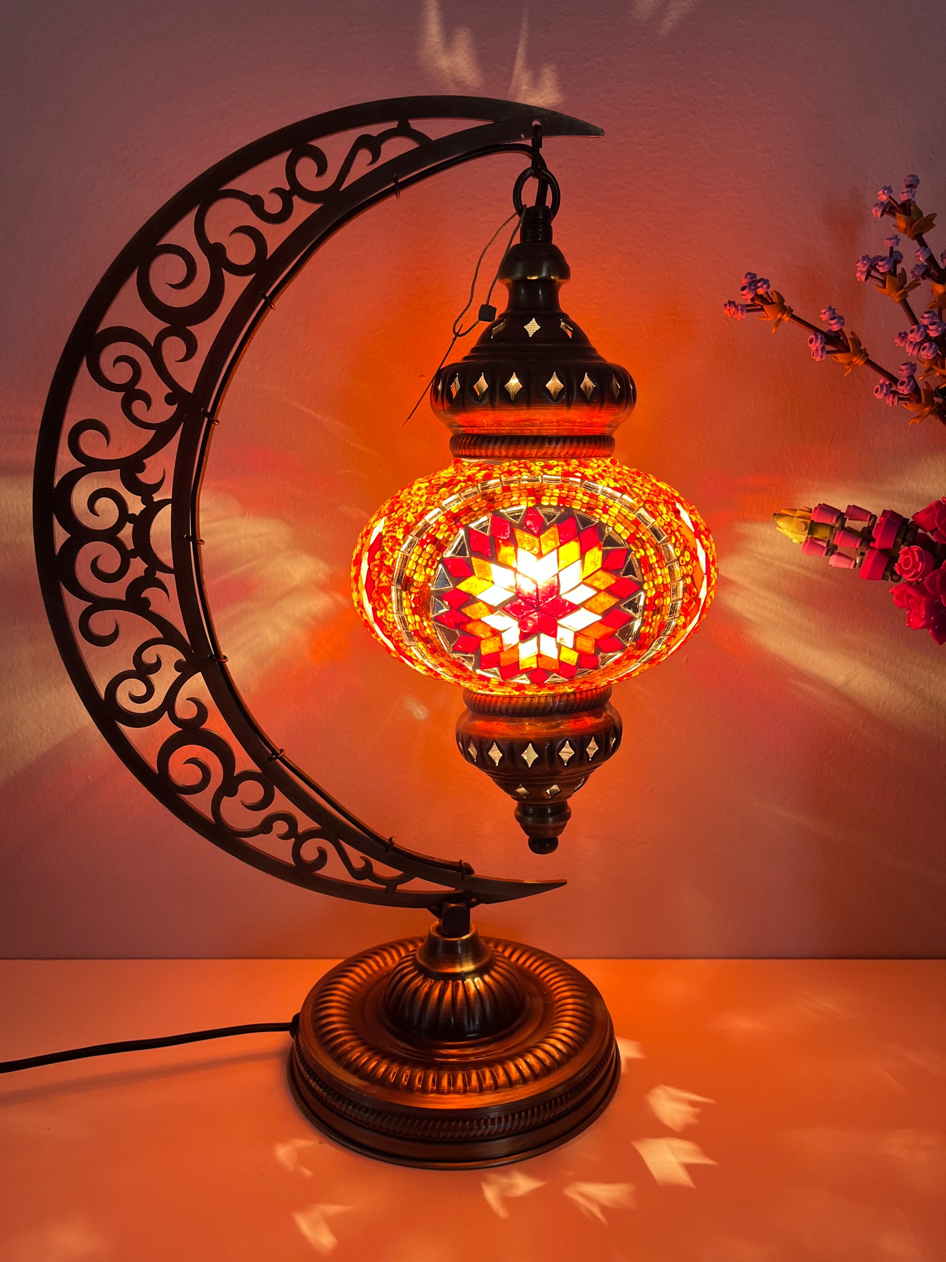 Elegant hanging Turkish lamp featuring red and orange mosaic, available in Calgary